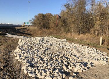 rocks on ground beside IH 35E widening project